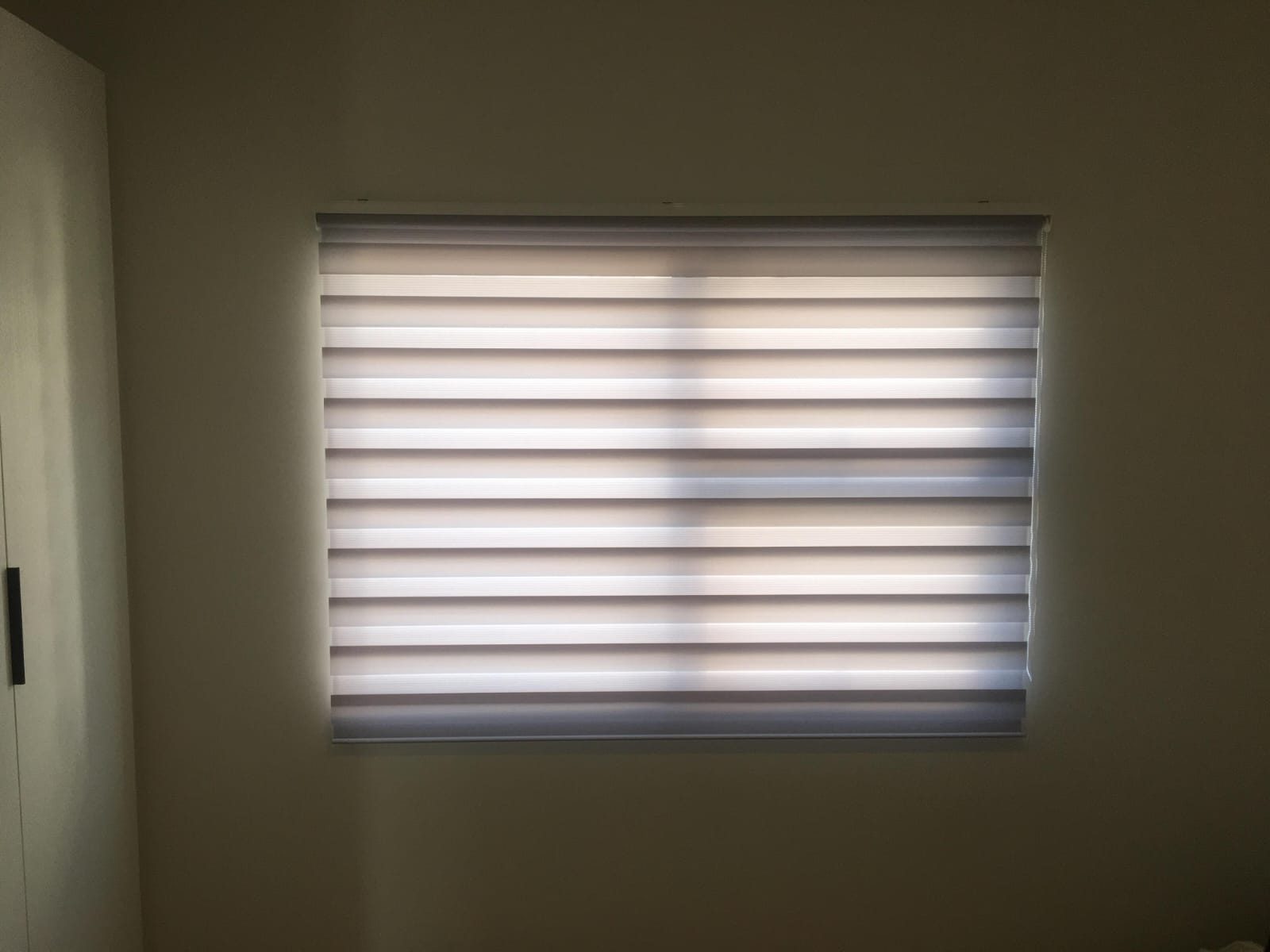 Roller blinds installed in a living space