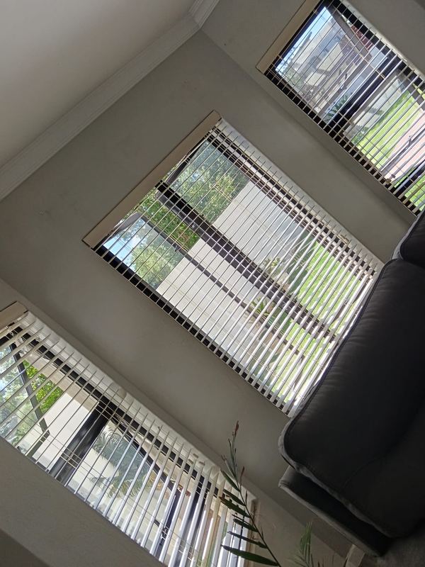 Vertical blinds fitted over security bars