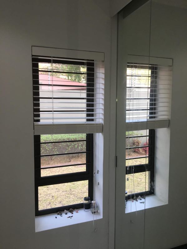 Venetian blinds to a window and stacking door