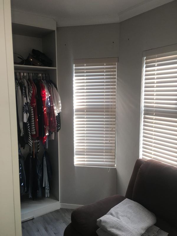 Venetian blinds across a bedroom bay