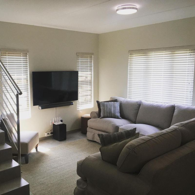 Venetian blinds either side of a lounge