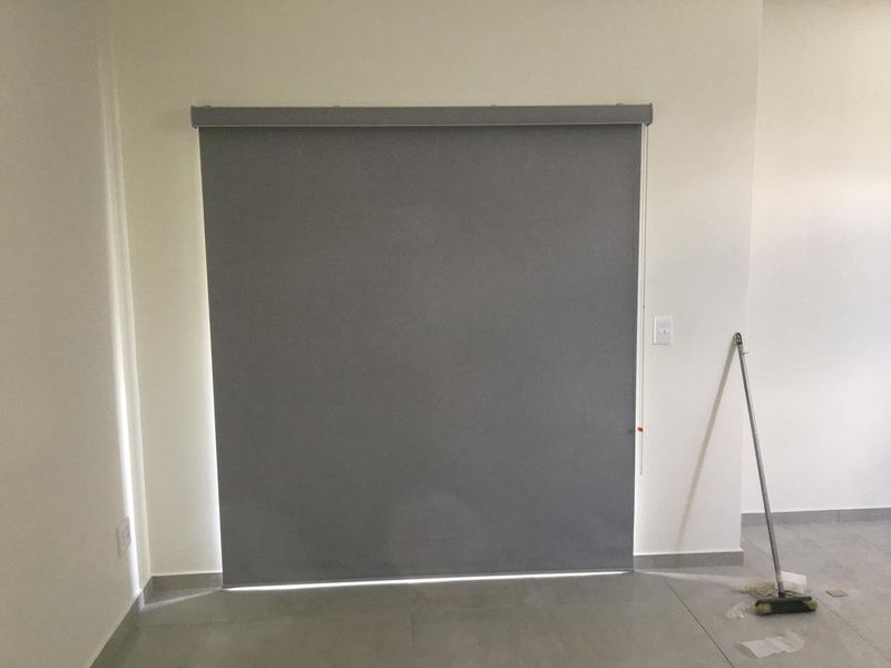 Blockout roller blind mounted to a wall