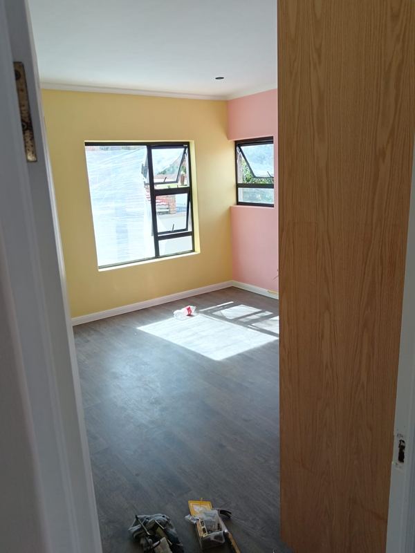 Plank flooring laid through a bedroom