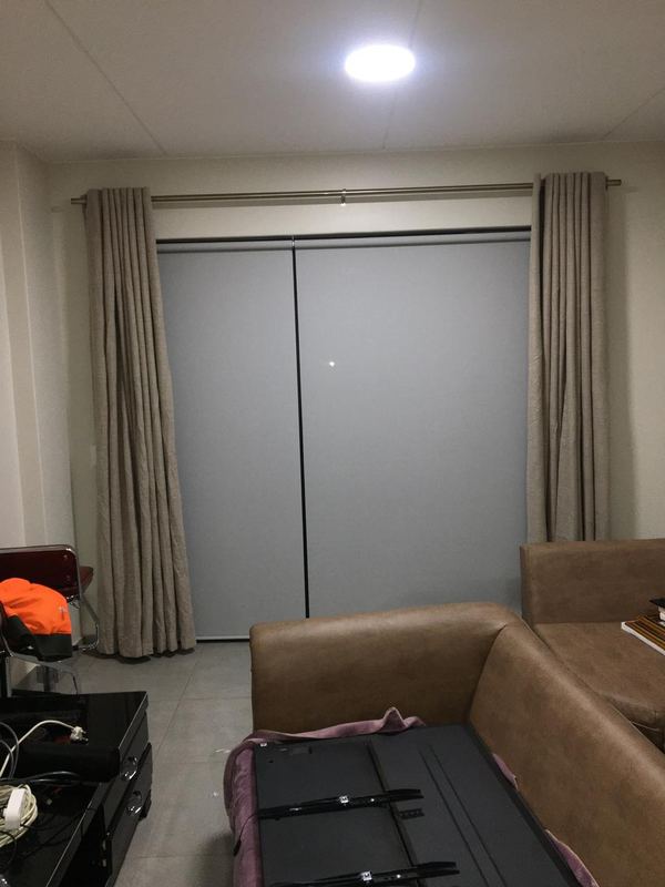 Curtains and track over a stacking door