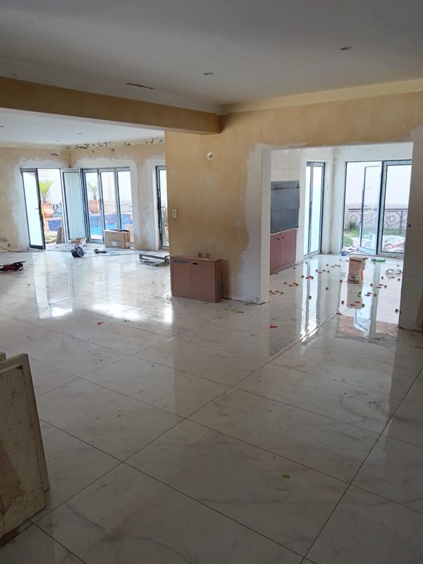 Polished porcelain floor through an open-plan living area
