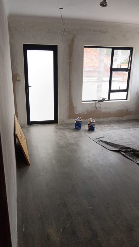 Wood-look flooring laid and trimmed