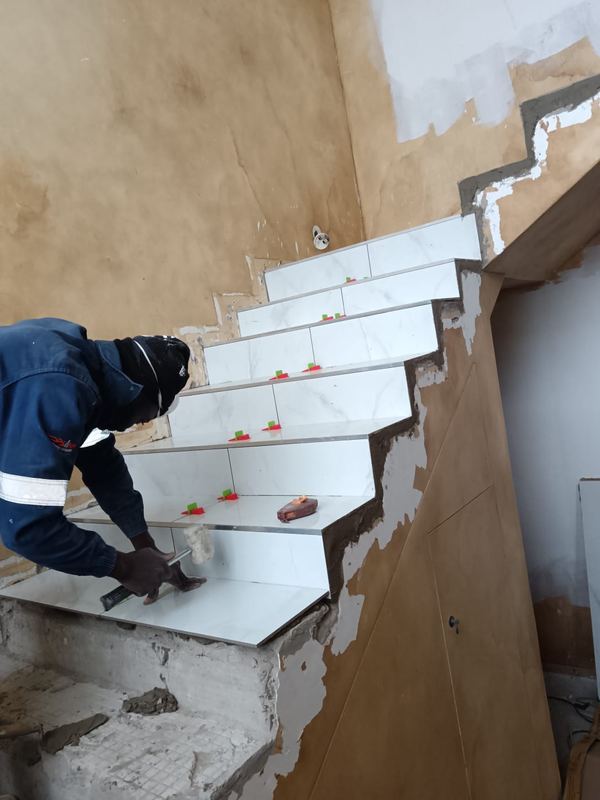 Marble tiles set to staircase treads and risers