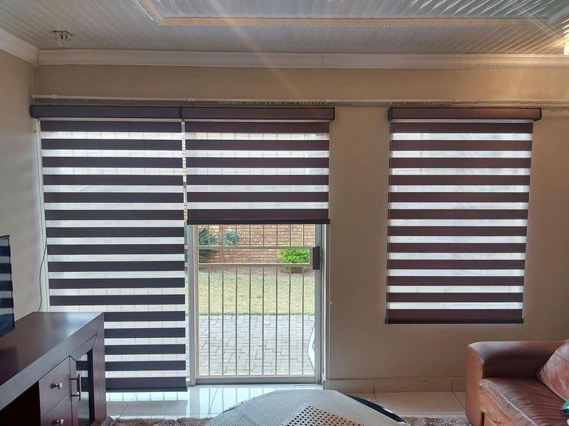 Day-night blinds to a lounge and patio door