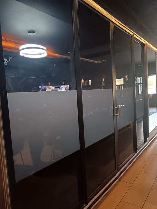 Frosted film applied to office glazing