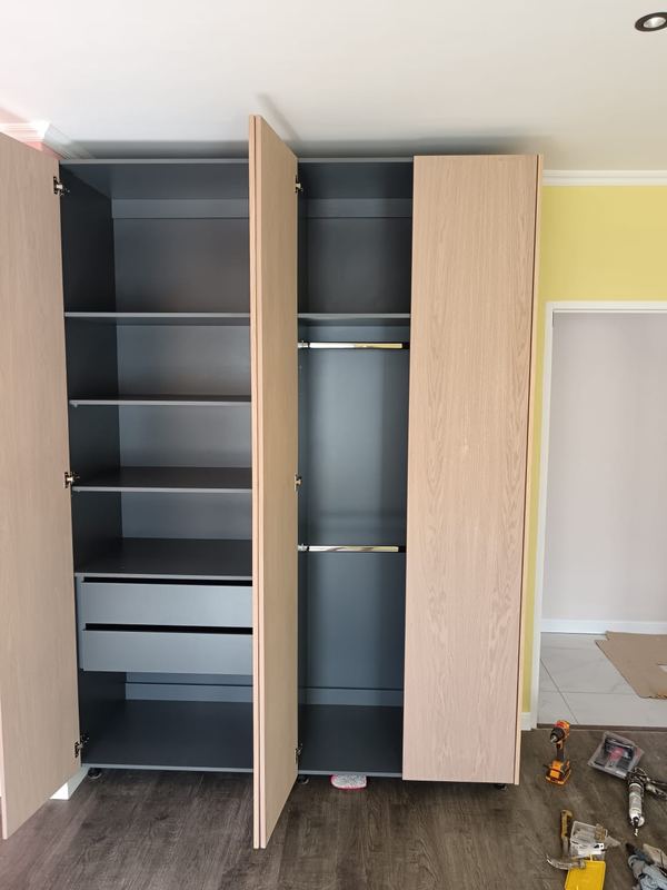 Wardrobe interior with shelving, drawers and hanging rails