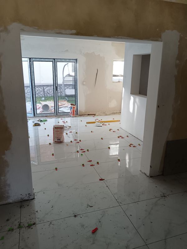 Polished floor tiles run through to the entrance