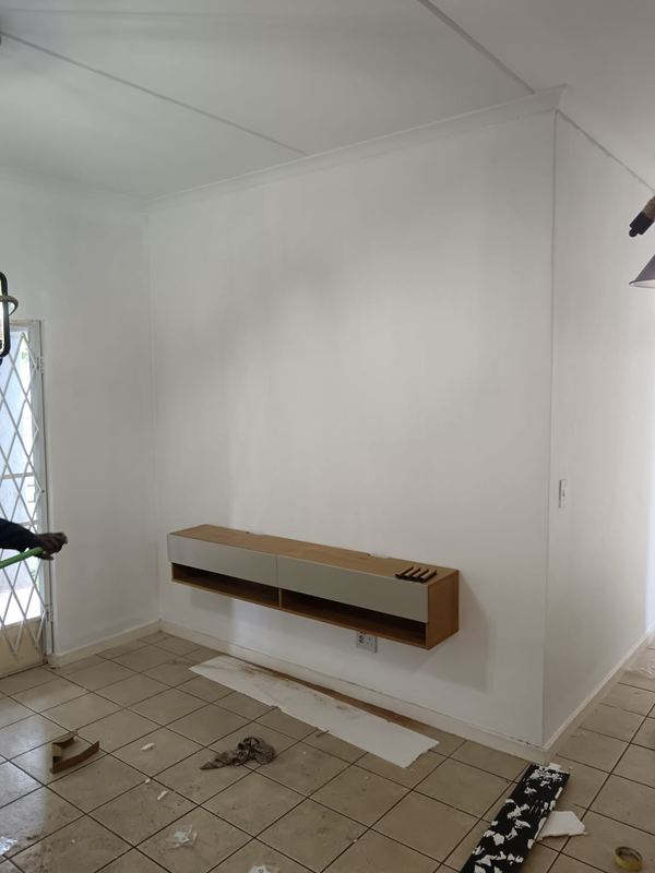 Floating console fixed to a plastered wall