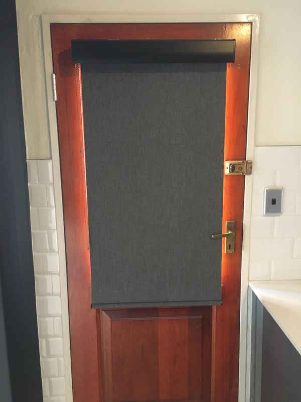 Blind fitted to a timber door panel