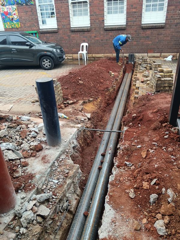 Drainage pipework laid and bedded in an open trench